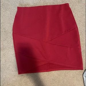 Maroon pencil skirt with asymmetrical hem